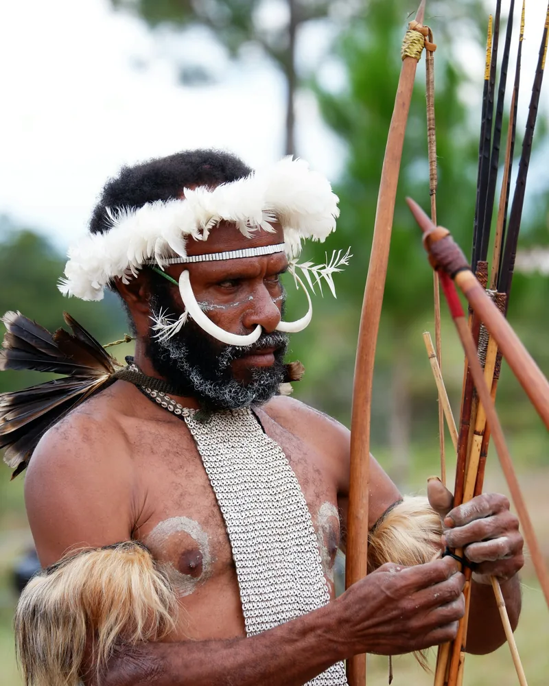 Dani elder with bow and arrows, Wamena