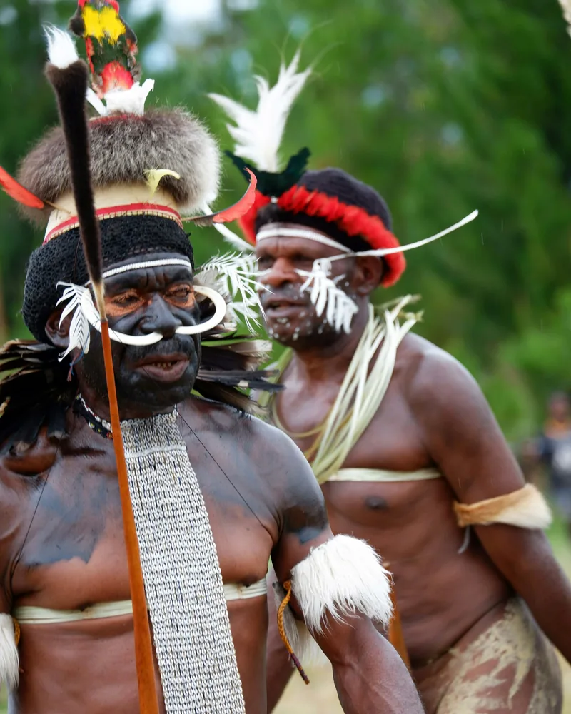 Two warriors in feather headdresses, Baliem Valley Festival